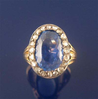 Appraisal: A th century sapphire and diamond cluster ring the oval