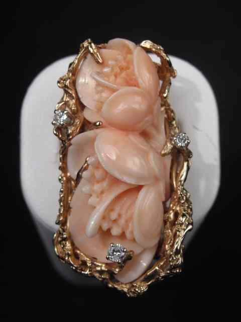 Appraisal: Light peach tone coral carved as two flowers with kt