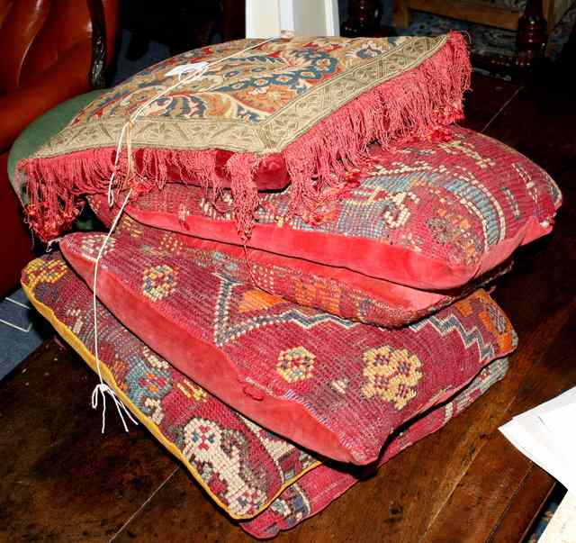 Appraisal: A COLLECTION OF SEVEN FILLED CUSHIONS six covered in Turkish