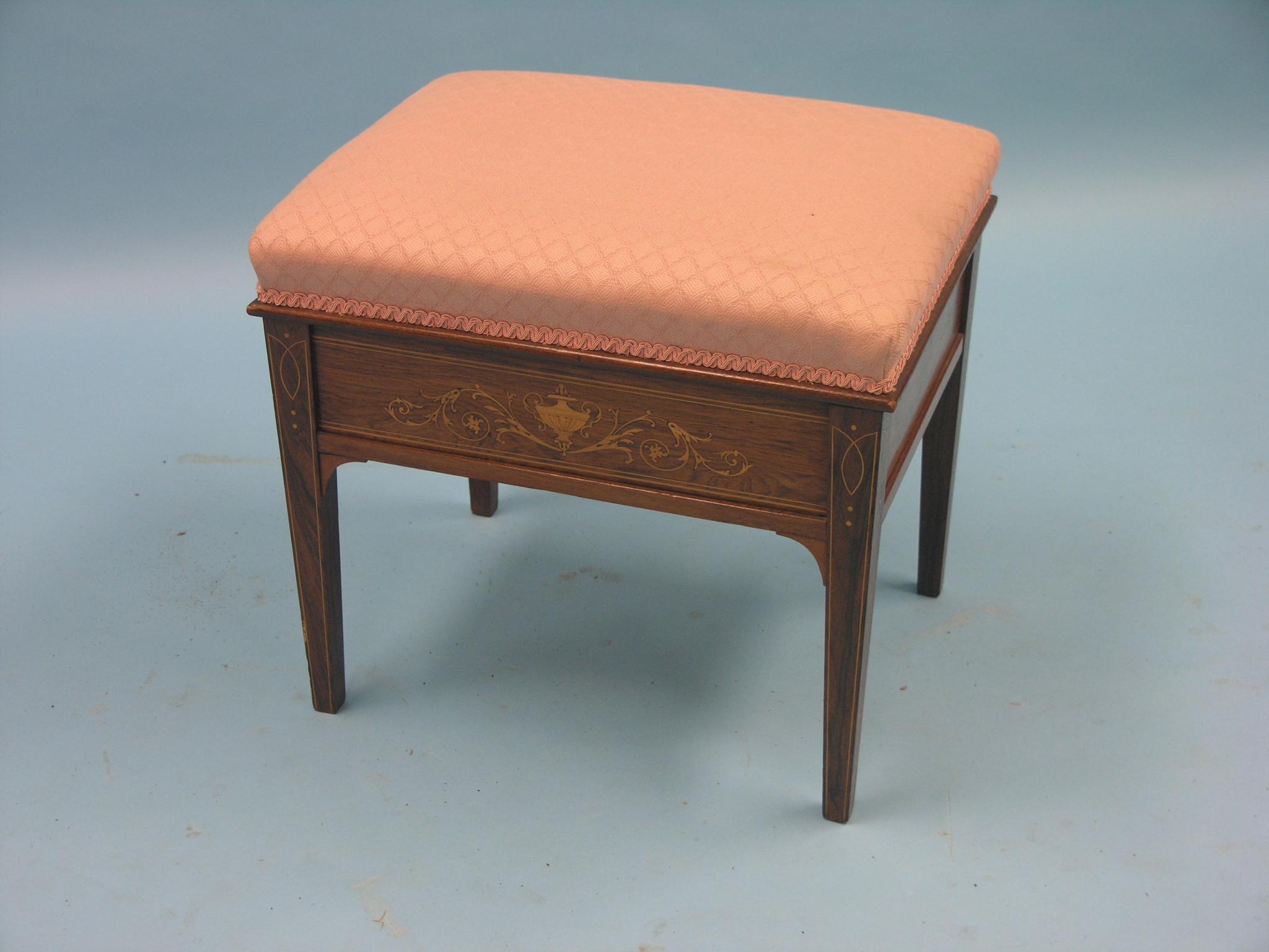 Appraisal: An Edwardian inlaid rosewood piano stool hinged upholstered seat above