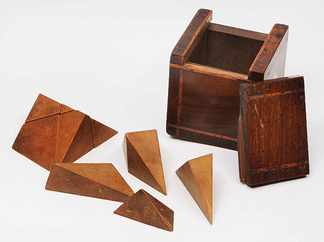 Appraisal: A BOXWOOD PUZZLE CUBE of lettered parts contained within a