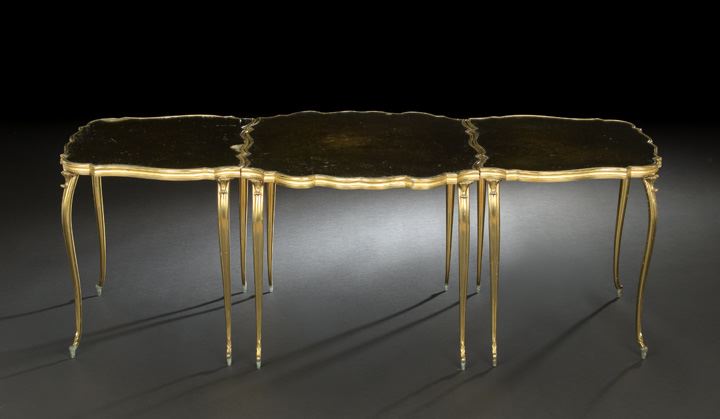 Appraisal: French Gilt-Brass and Smoked Mirrored Glass Cocktail Table of tripartite