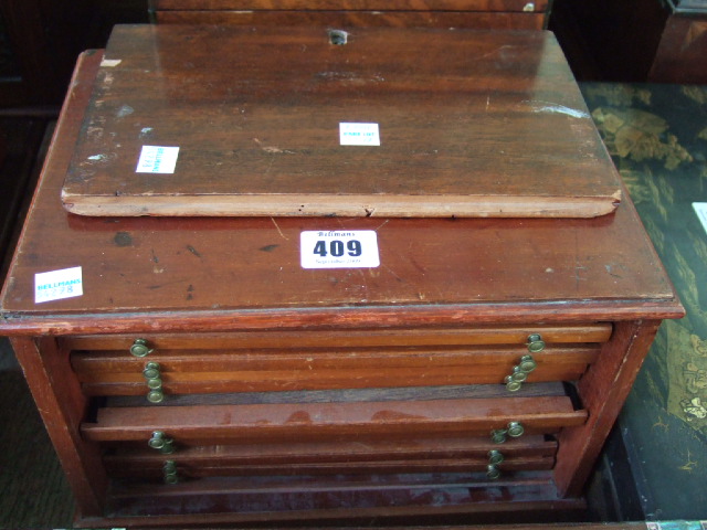 Appraisal: A mahogany coin collectors cabinet fitted with twelve coin trays