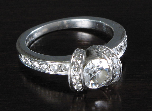 Appraisal: TIFFANY CO DIAMOND RING WITH APPRAISAL platinum band marked 'Tiffany