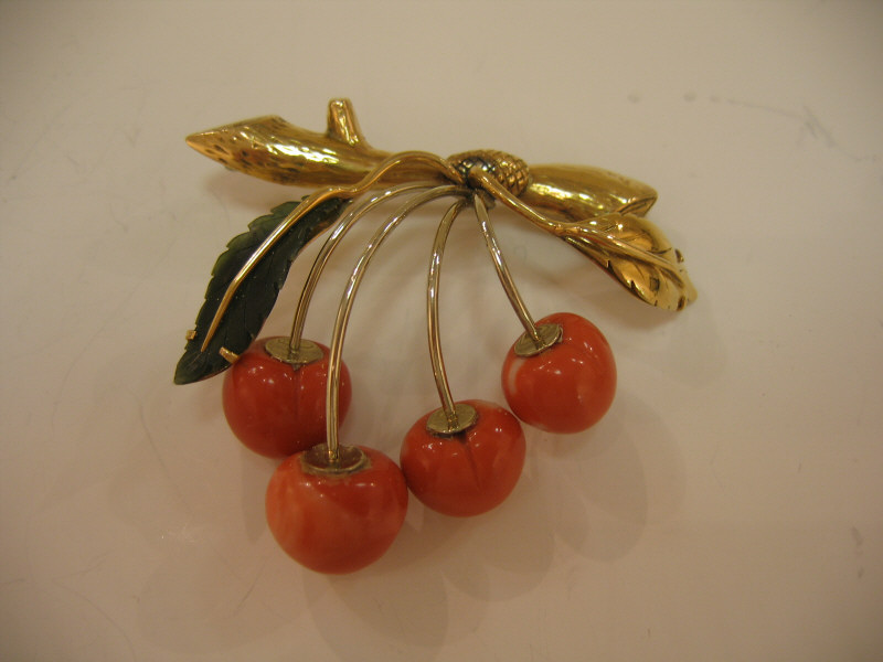 Appraisal: CORAL BROOCH k yellow gold brooch with coral cherries suspended