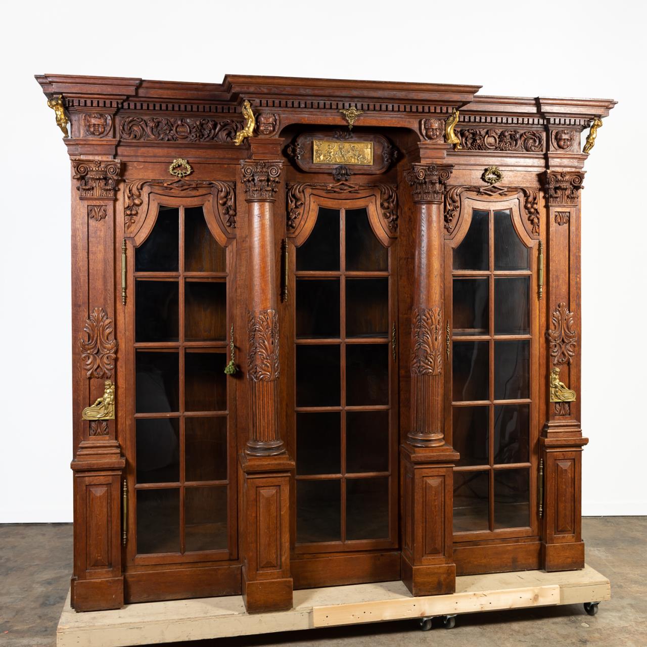 Appraisal: PALATIAL RENAISSANCE STYLE OAK BREAKFRONT BOOKCASE European early th century