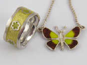 Appraisal: A silver and enamel butterfly necklace together with a white