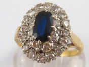 Appraisal: A yellow metal tests carat gold sapphire and diamond ring