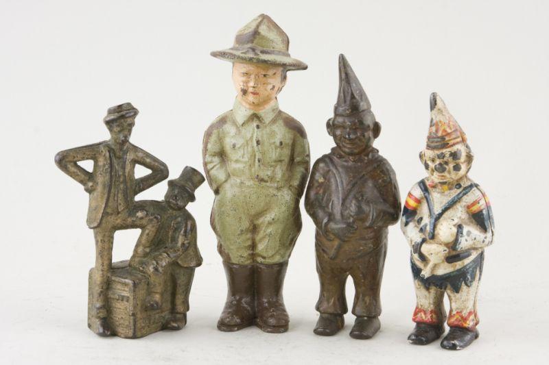 Appraisal: Figural Cast Iron Banks as follows Mutt Jeff Boy Scout