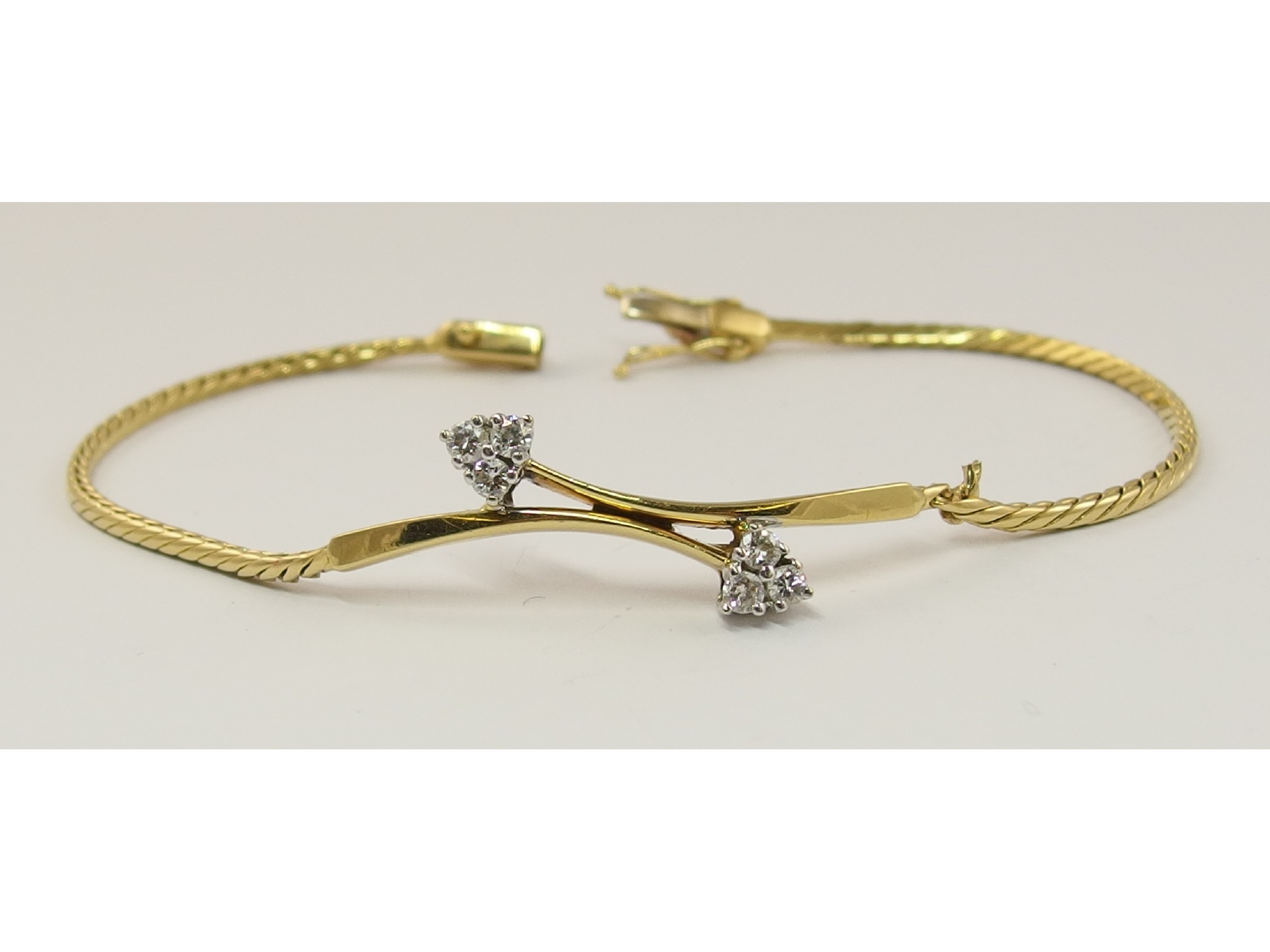 Appraisal: An ct gold diamond braceletof twin arrow design set with