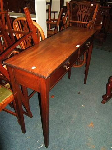 Appraisal: A Victorian mahogany side table with two short drawers standing