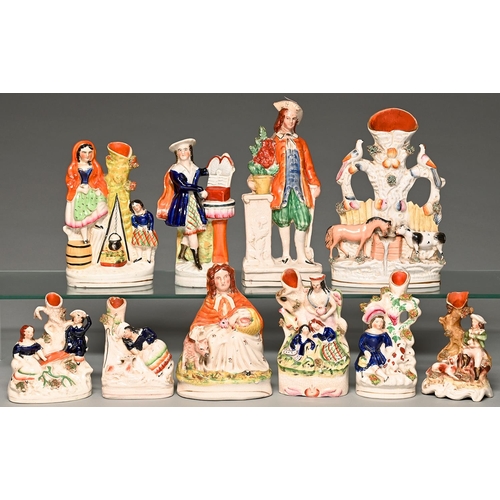 Appraisal: Seven Staffordshire flatback earthenware spill holder figures and groups and