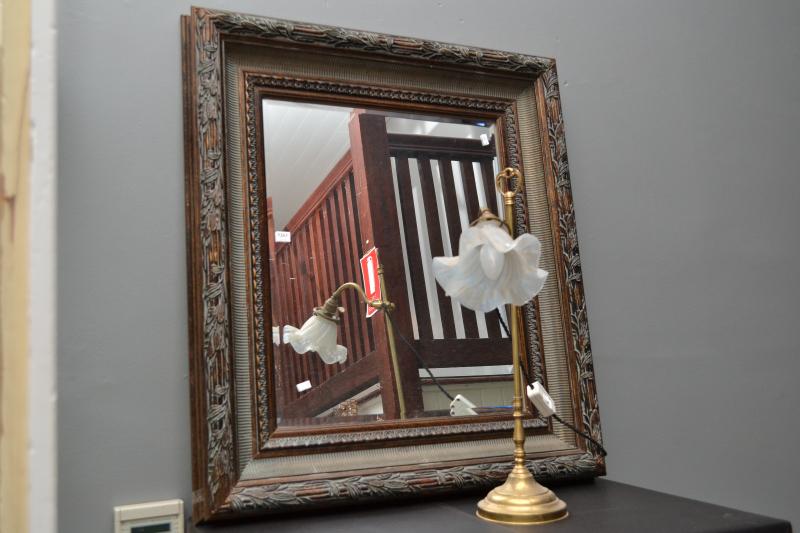 Appraisal: A DECORATIVE RECTANGULAR MIRROR FEATURING A BEVELLED EDGE