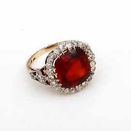 Appraisal: An ct gold orange garnet and thirty four diamond set