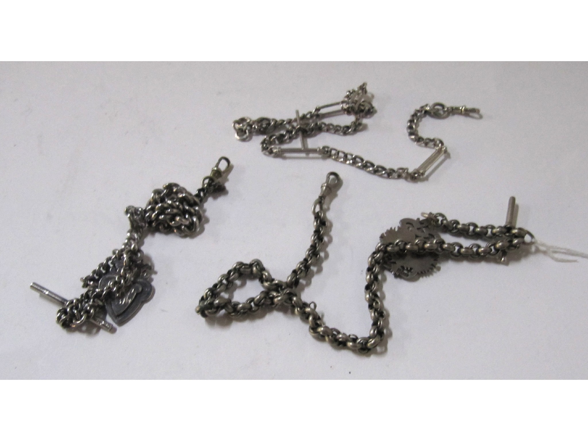 Appraisal: A lot comprising three silver Albert chains