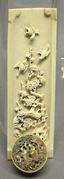 Appraisal: Two ivory decorations th Century The first a wrist rest