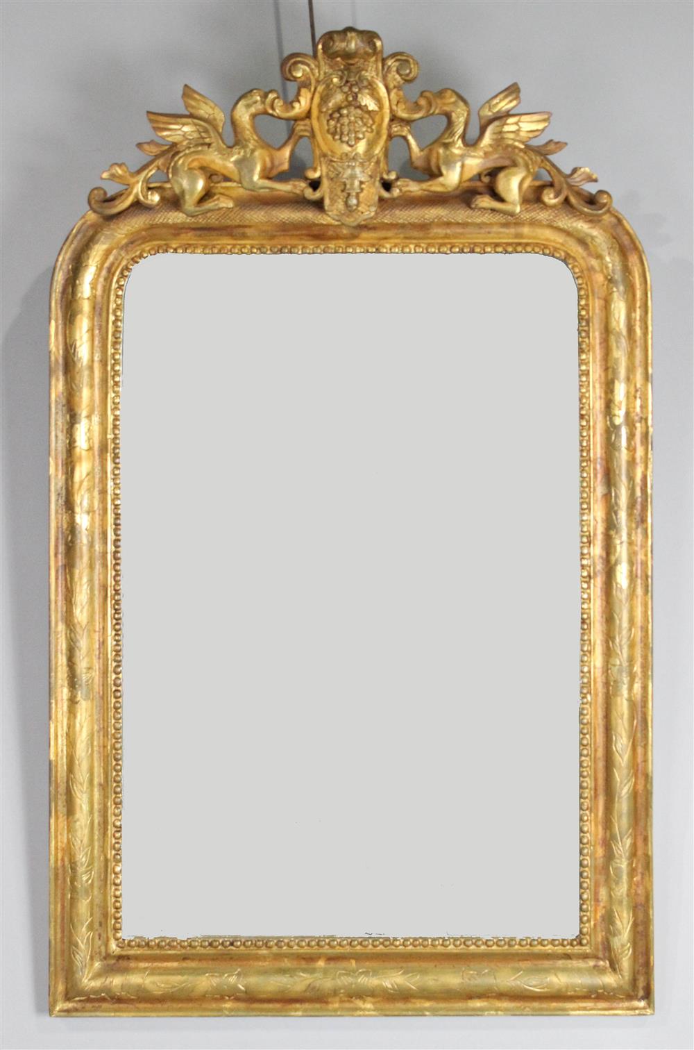 Appraisal: NEOCLASSICAL STYLE CARVED GILTWOOD MIRROR having a crest with carved