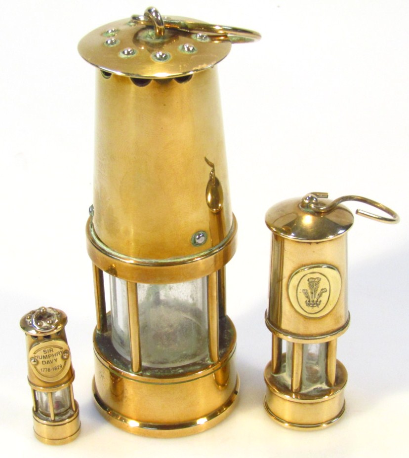 Appraisal: Two thC graduated miniature miner's lamps each of cylindrical outline