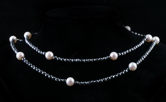 Appraisal: BLACK DIAMOND AND CULTURED PEARL NECKLACE mm faceted round diamond