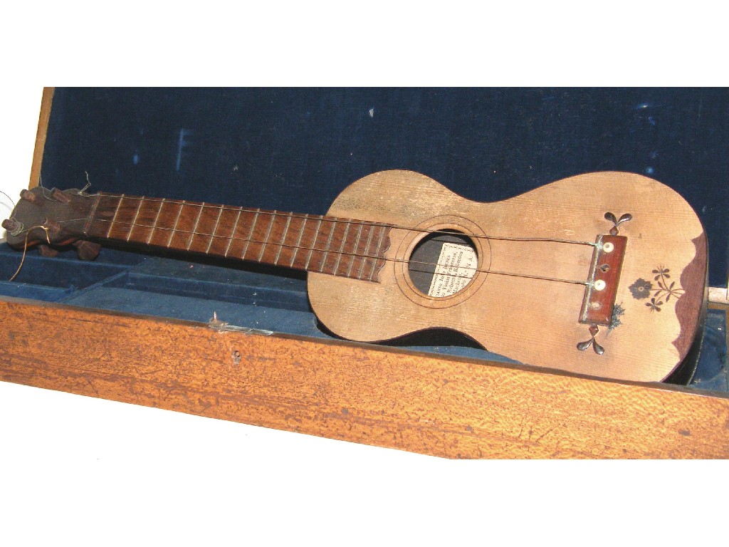 Appraisal: Interesting old guitar shaped Machetes labelled Octavianno Joao Nunes Madeira