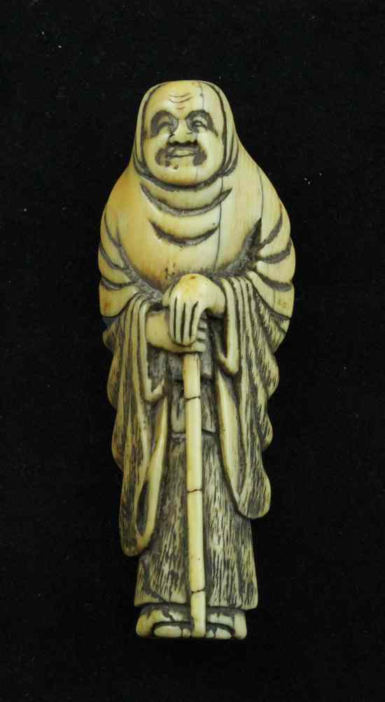 Appraisal: An Edo period ivory netsuke carved as Gama Senin ins