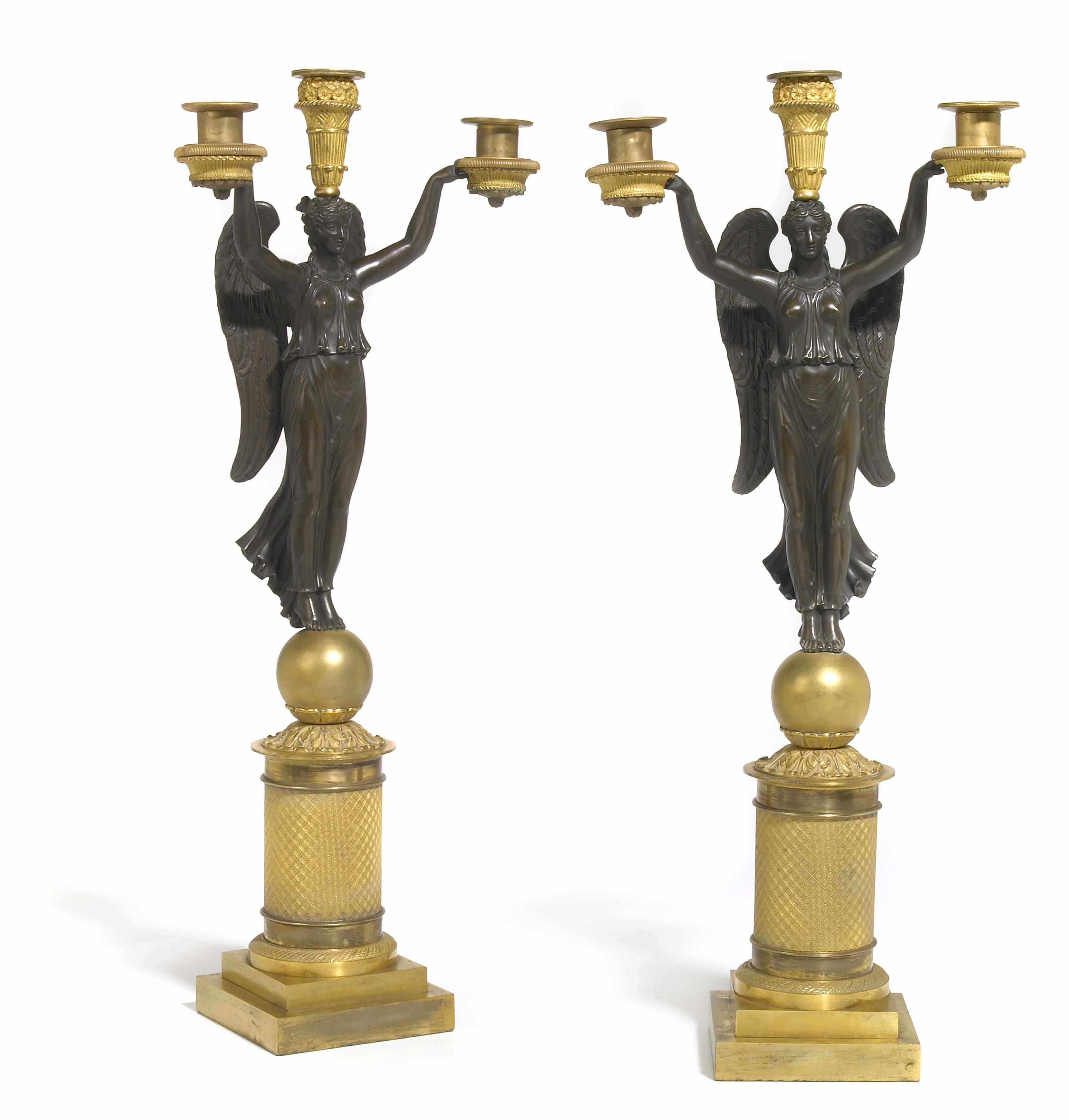 Appraisal: A pair of Empire style patinated and gilt bronze three