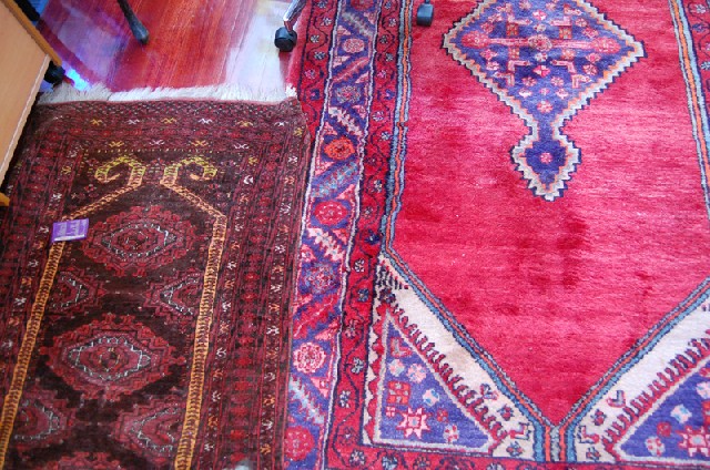 Appraisal: TWO PERSIAN FLOOR RUGS Each with a geometric pattern on