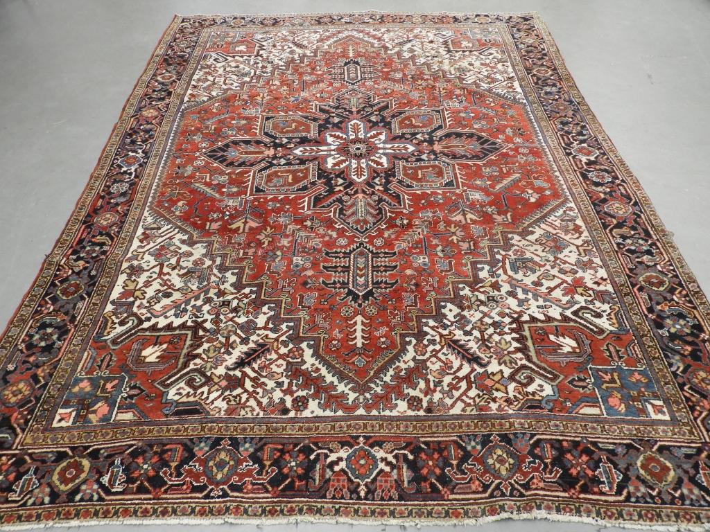 Appraisal: PERSIAN HERIZ ROOM SIZE CARPET RUG Persia Circa Central red