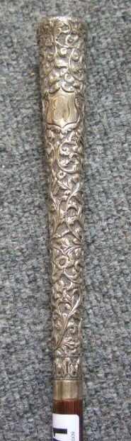 Appraisal: A sword spike with continental silver scroll work handle and