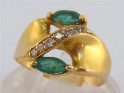 Appraisal: An carat gold emerald and diamond ring the two navette