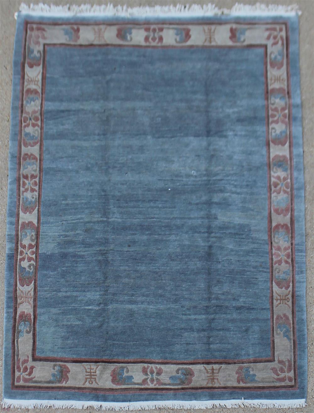 Appraisal: CONTEMPORARY CHINESE WOOL RUG WITH FLORAL BORDER having a slightly