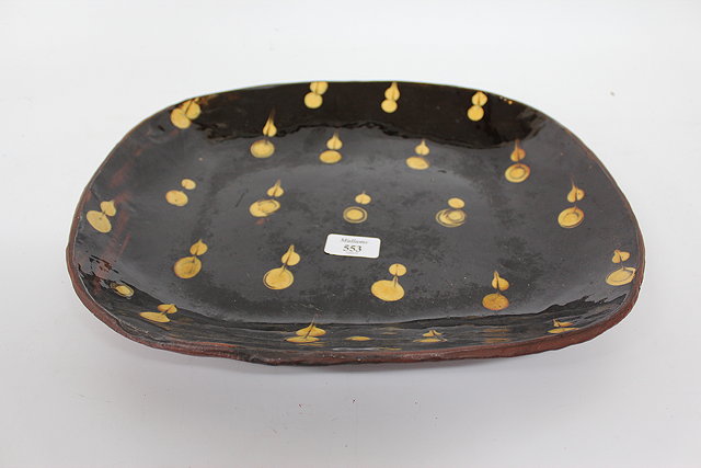 Appraisal: A STUDIO POTTERY SLIPWARE DECORATED OVAL PLATTER with impressed mark