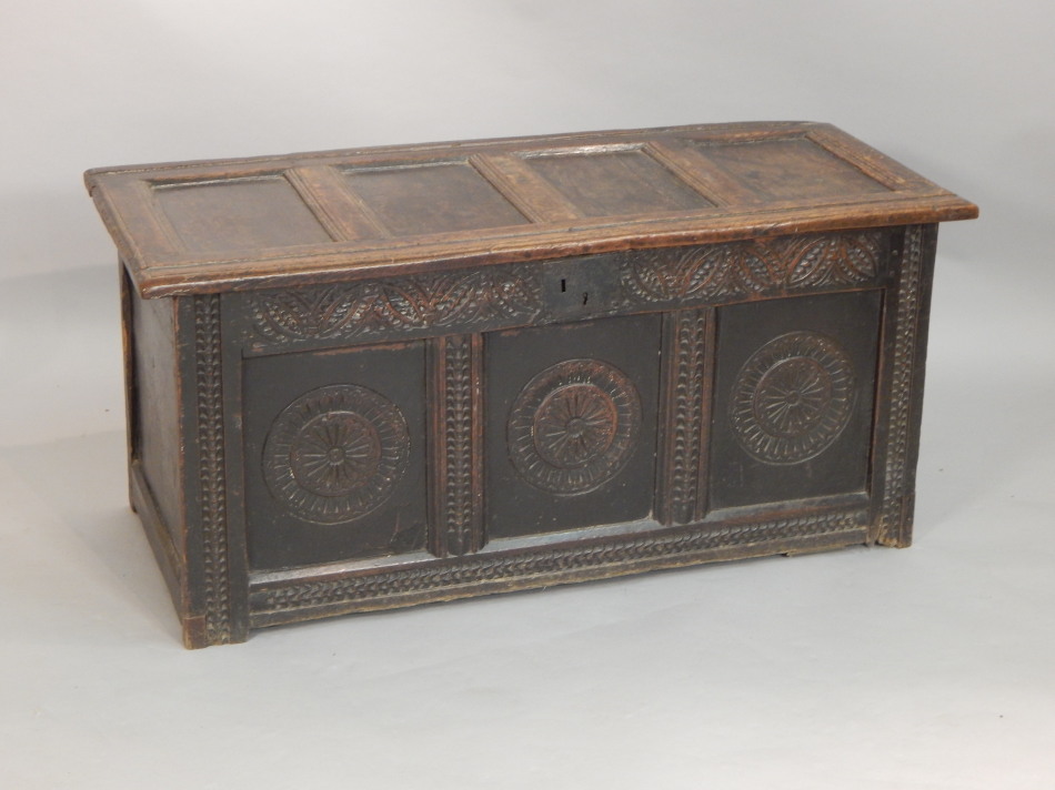 Appraisal: An thC oak coffer with a carved frieze and roundels