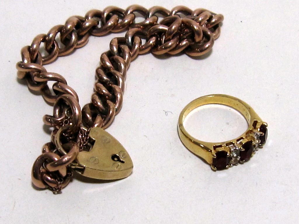 Appraisal: Lot comprising yellow metal curb link bracelet and a rolled