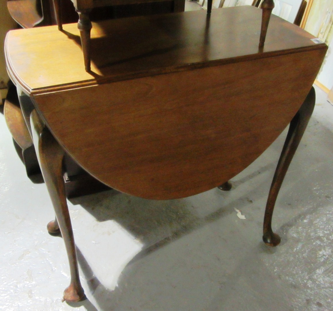 Appraisal: A th century mahogany drop flap oval table