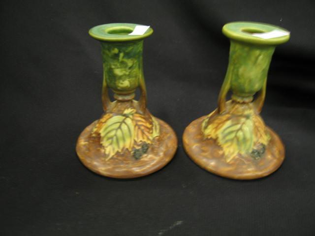 Appraisal: Roseville Blackberry Art Pottery Candlesticks pair handled excellent