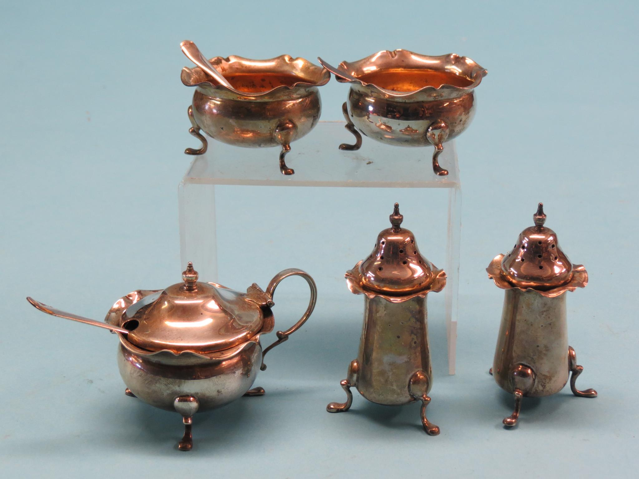 Appraisal: A silver five-piece condiment set with three silver server spoons