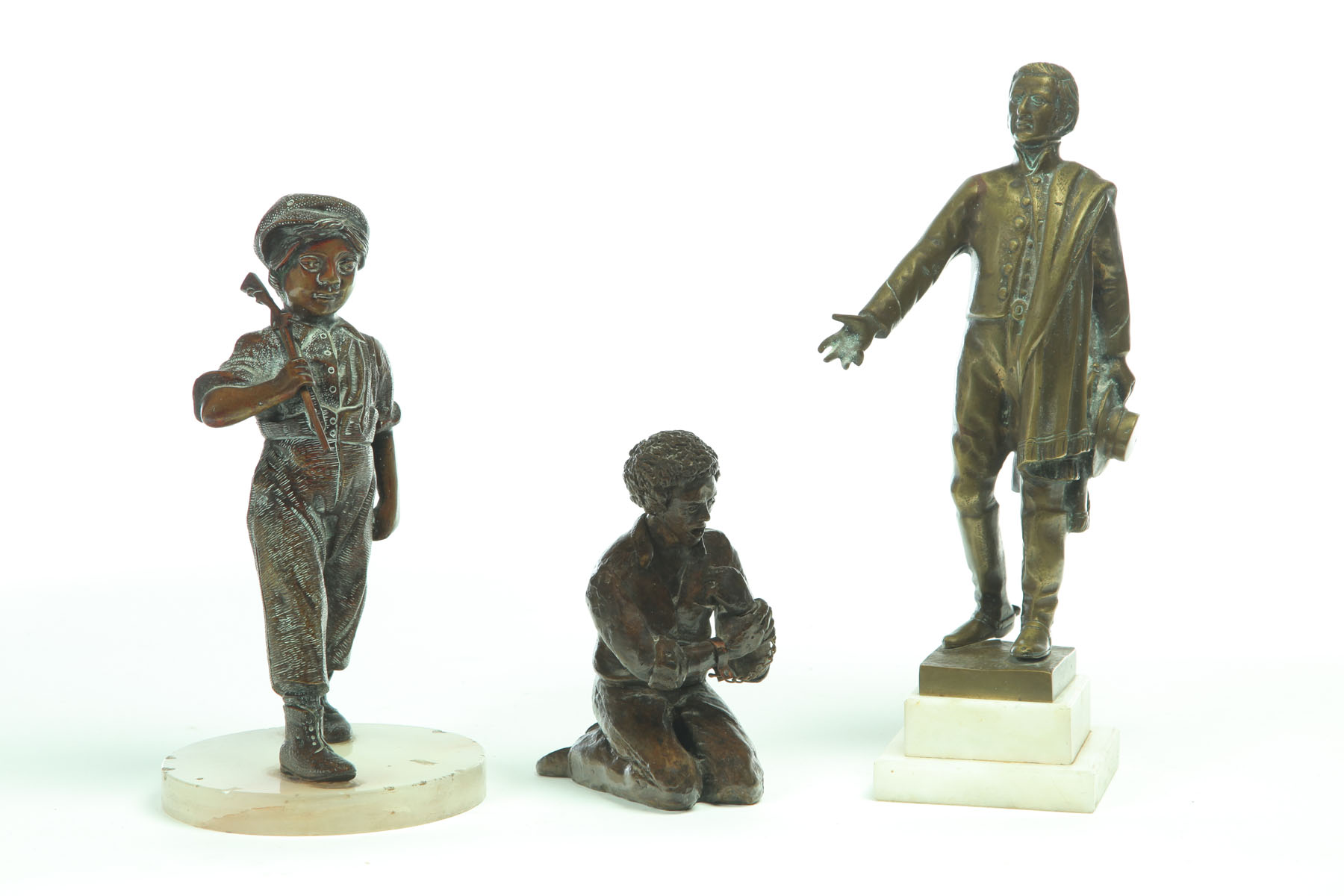 Appraisal: THREE STATUES American th century Two bronze figures A boy