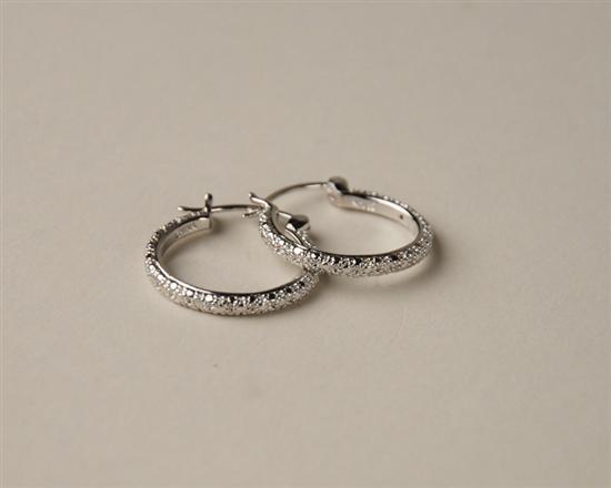 Appraisal: A Pair of Sterling and Diamond Earrings in hoop form