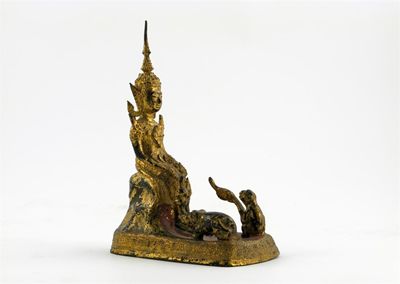 Appraisal: A small Thai gilt bronze figure seated with a monkey