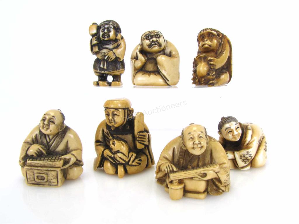 Appraisal: Group of Oriental Carved Netsuke seven total including figure leaning