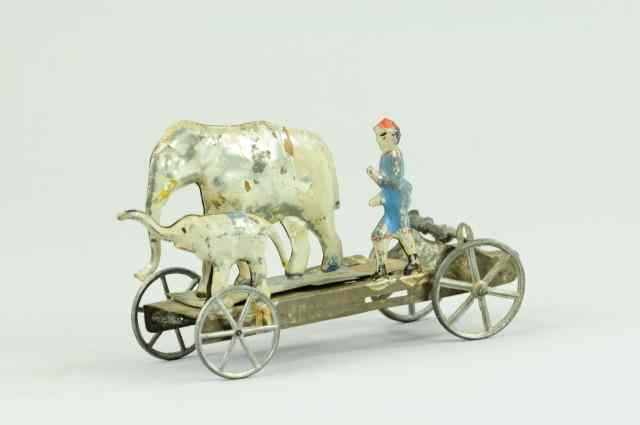 Appraisal: ELEPHANT WITH FIGURE ON PLATFORM BELL TOY Fallows pat early