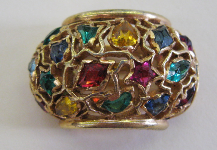 Appraisal: Multi-Stone Lapel Clip ca of arched shaped the gold-toned openwork