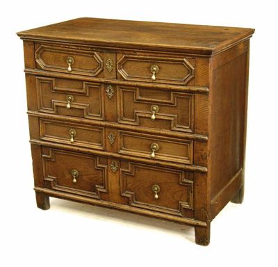 Appraisal: A joined oak chest the boarded top with an applied