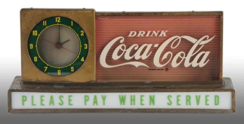 Appraisal: Coca-Cola Countertop Light-Up Clock Sign Description s Fairly heavy soiling