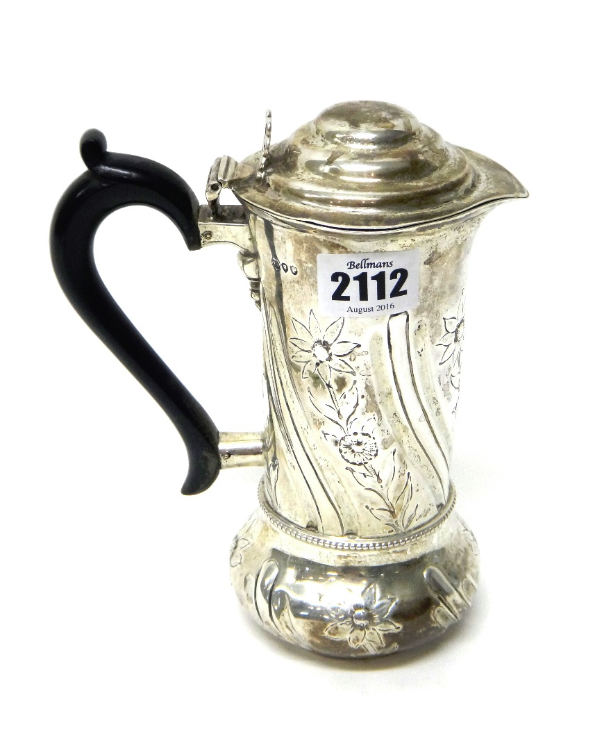 Appraisal: A Victorian silver hot water jug decorated with floral and