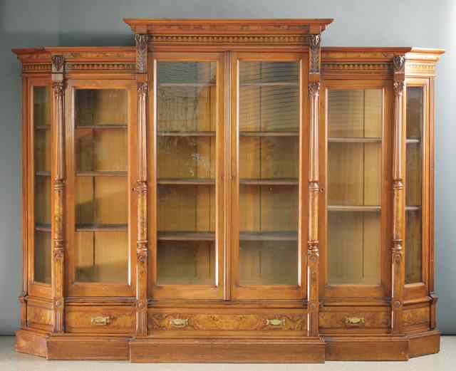 Appraisal: LATE VICTORIAN WALNUT BREAKFRONT BOOKCASE Renaissance Revival design American c