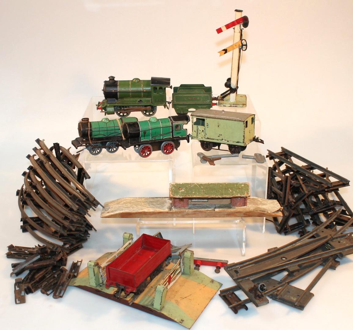 Appraisal: Various tinplate O-gauge trains and accessories to include a clockwork