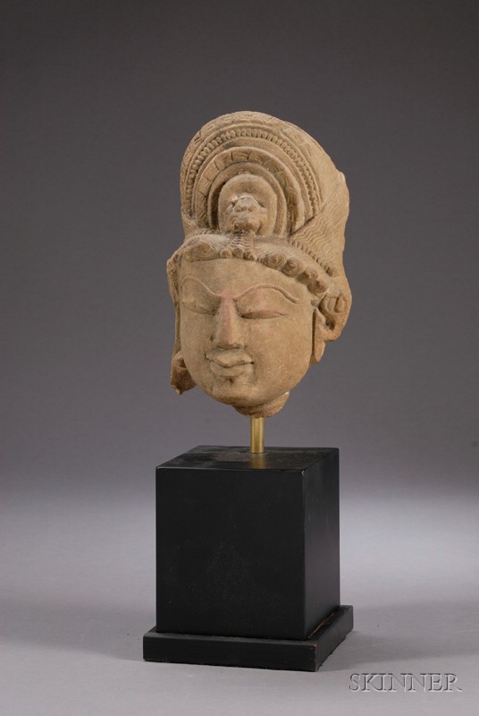 Appraisal: Sandstone Head northern India th century elaborately coiffed head of