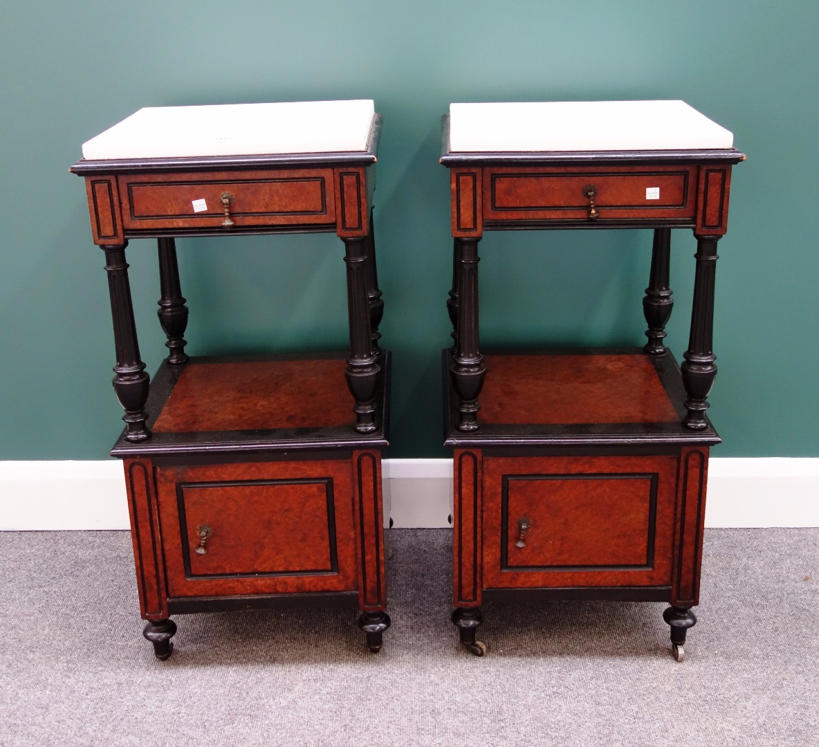 Appraisal: A pair of th century French amboyna and ebonised bedside